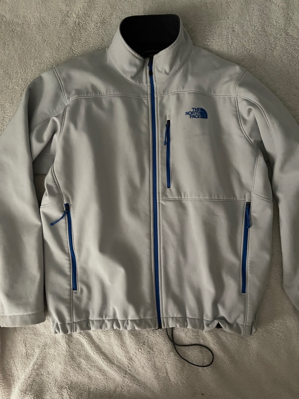 The North Face Light Gray Softshell Jacket with Blue Zippers